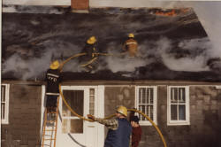 Men cutting up the roof